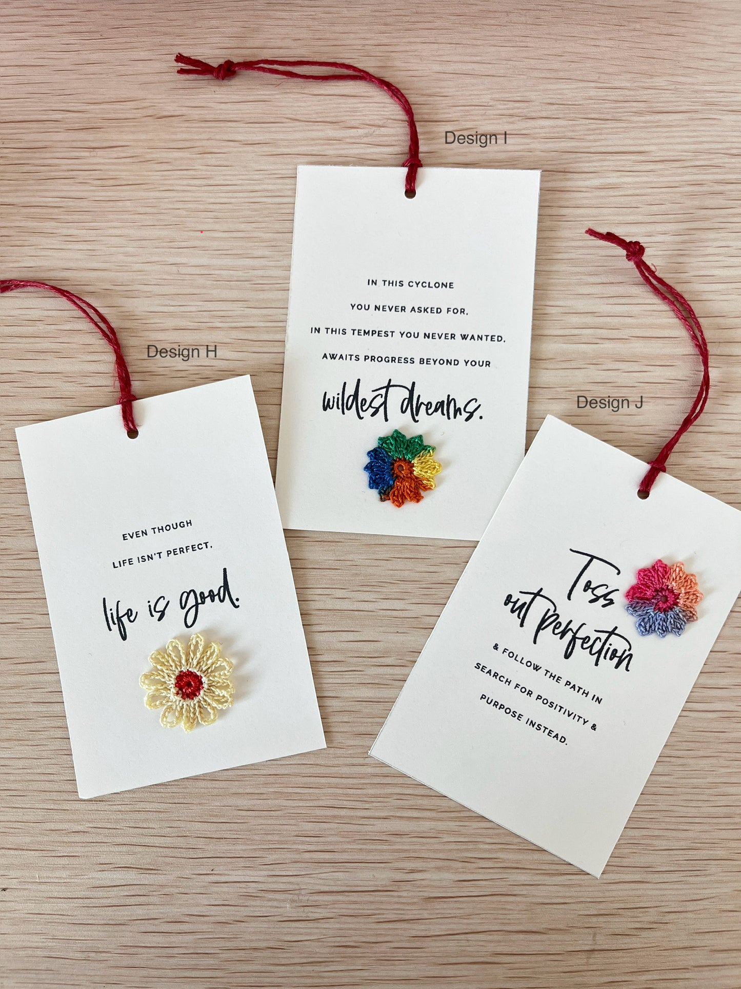 3 notecards with inspirational quotes embellished with multi-color crochet flower motifs. eco friendly gifting ideas, uplifting gift, handcrafted in Singapore.